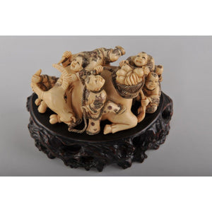 Mammoth Ivory- Kids Playing on a Bull