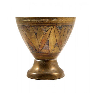 A small brass cup